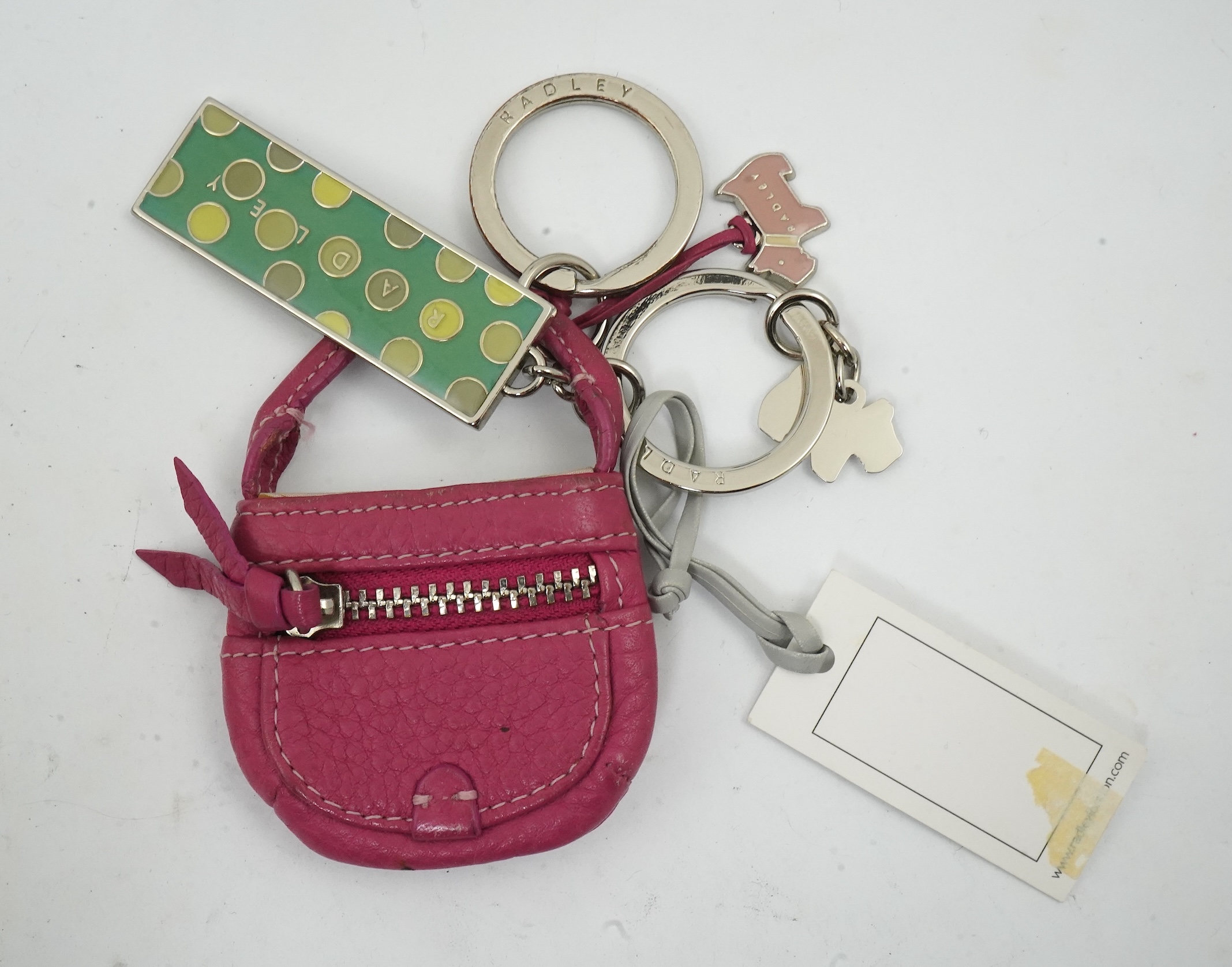 A Radley handbag, key fob and small bag.